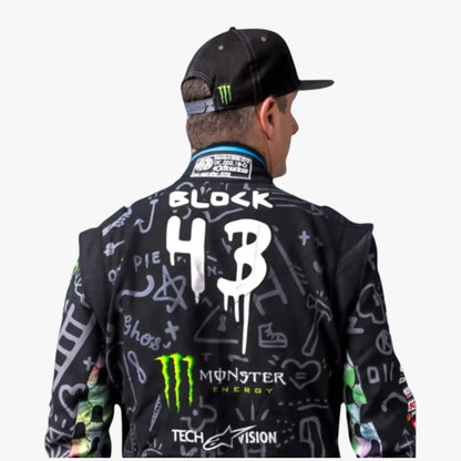 Racing jacket with a black base and white graffiti-style graphics, featuring 'BLOCK 43' on the back, a green Monster Energy logo, and a black cap with a green Monster logo, shown on a model from the back against a light gray background.
