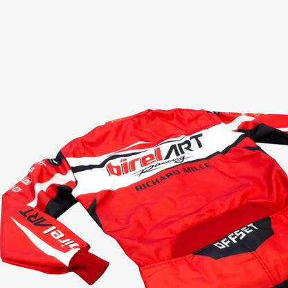 A red long-sleeve racing jersey with white and black graphics, featuring 'birelART Racing' and 'RICHARD MILLE' printed on the chest, laid flat against a light gray background.