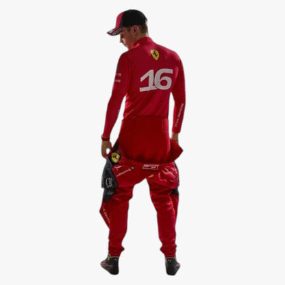 A man wearing a red Ferrari racing tracksuit, viewed from the back. The tracksuit features the number 16 on the back, a Ferrari logo on the neck, and matching red pants.
