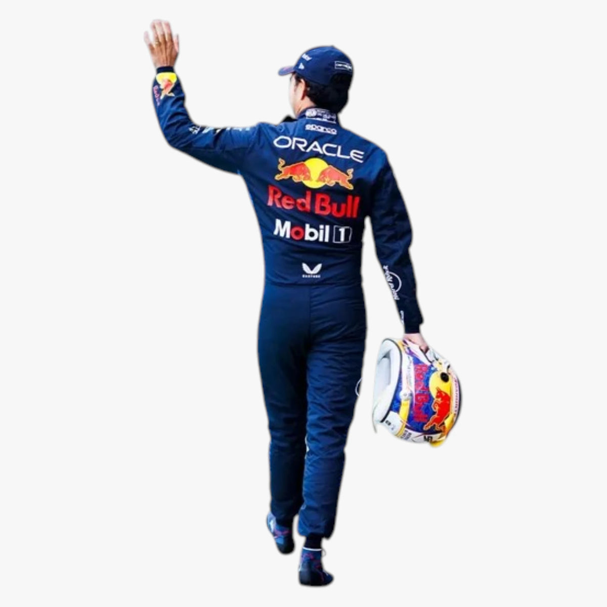 A Red Bull Racing driver seen from behind, wearing a dark blue Oracle Red Bull Motorsport suit with sponsor logos, a matching cap, and carrying a colorful Red Bull helmet against a plain white background.