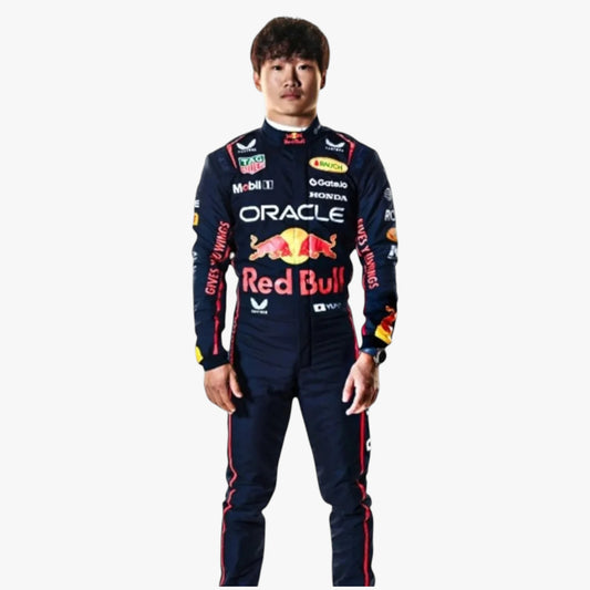 A man wearing a dark navy Red Bull Racing long-sleeve racing suit with multiple sponsor logos, including Oracle, Honda, and TAG Heuer, standing against a plain light gray background.