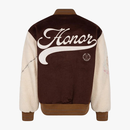 Back view of a varsity-style jacket with a dark brown velvet body, cream sherpa sleeves, and a large white script 'Honor' graphic across the back.