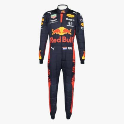A full-length racing suit displayed on a mannequin against a plain light gray background. The suit is predominantly dark navy blue with prominent red side stripes and a large red, yellow, and white Red Bull logo on the chest, along with multiple sponsor logos.