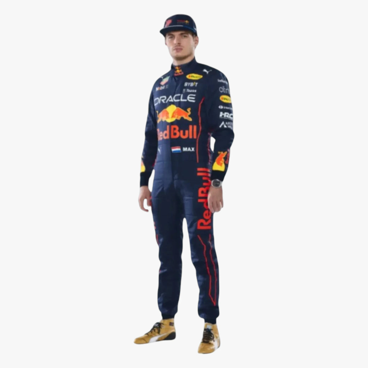 A full-body studio shot of Red Bull Racing driver Max Verstappen wearing his navy blue team racing suit, cap, and yellow-and-black shoes against a plain white background.