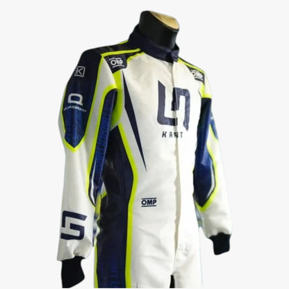 A white, navy, and neon yellow racing suit displayed on a mannequin torso against a light gray background. The suit features the number 11 and the name 'KART' on the chest, along with sponsor logos such as OMP and DRS.